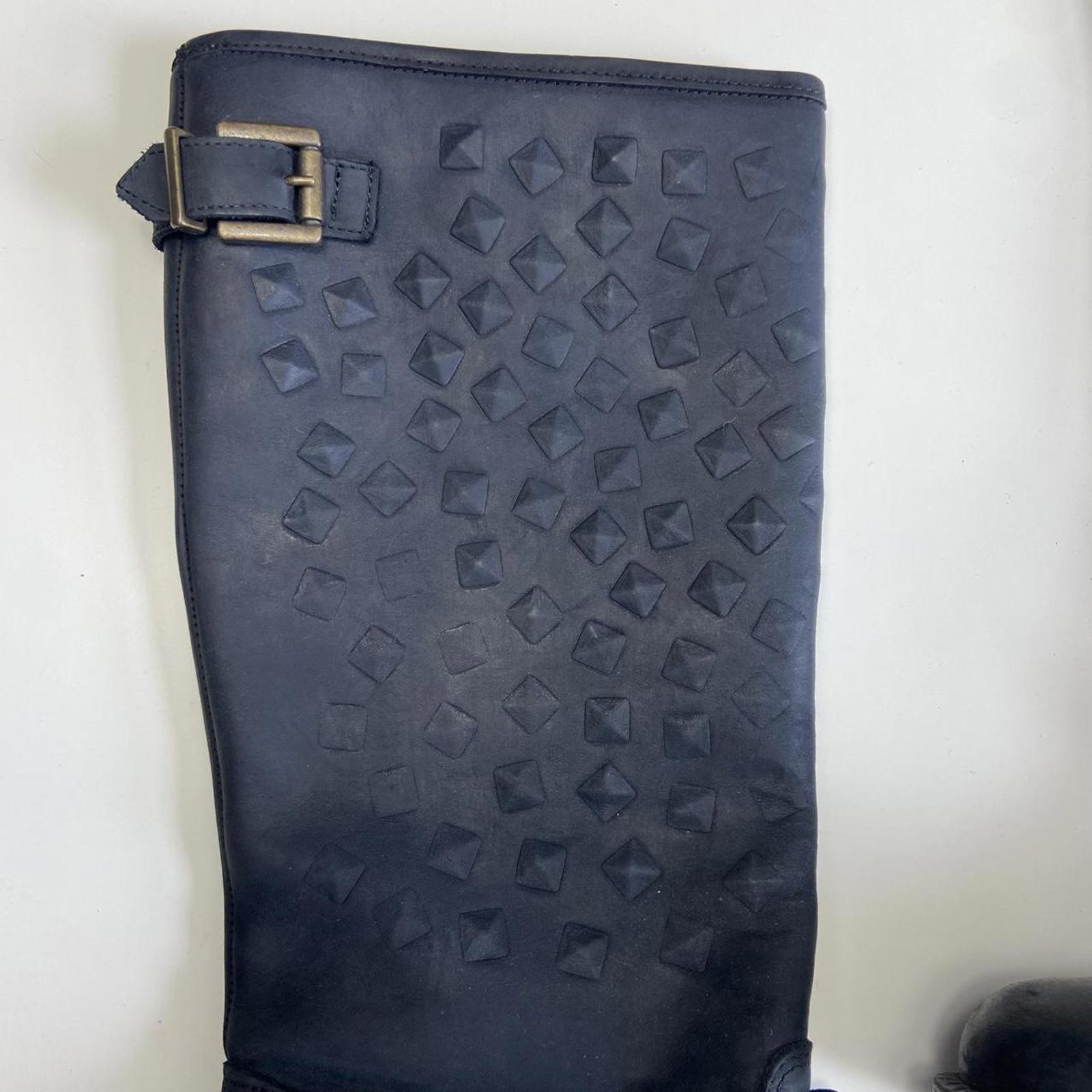 Black leather knee-high boots with buckles and studs!