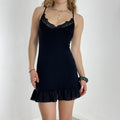 Vintage black elasticaled dress with lace trimming and flared hem