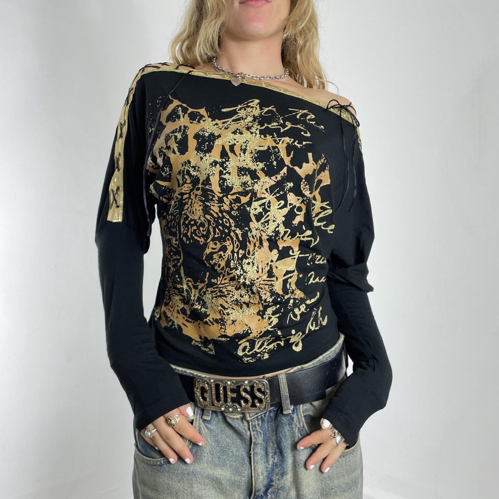 Off-the-shoulder gold and black graphic batwing top