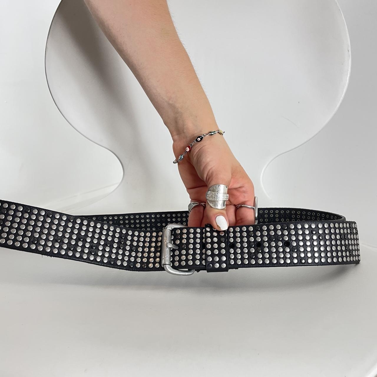 Studded silver belt on black leather
