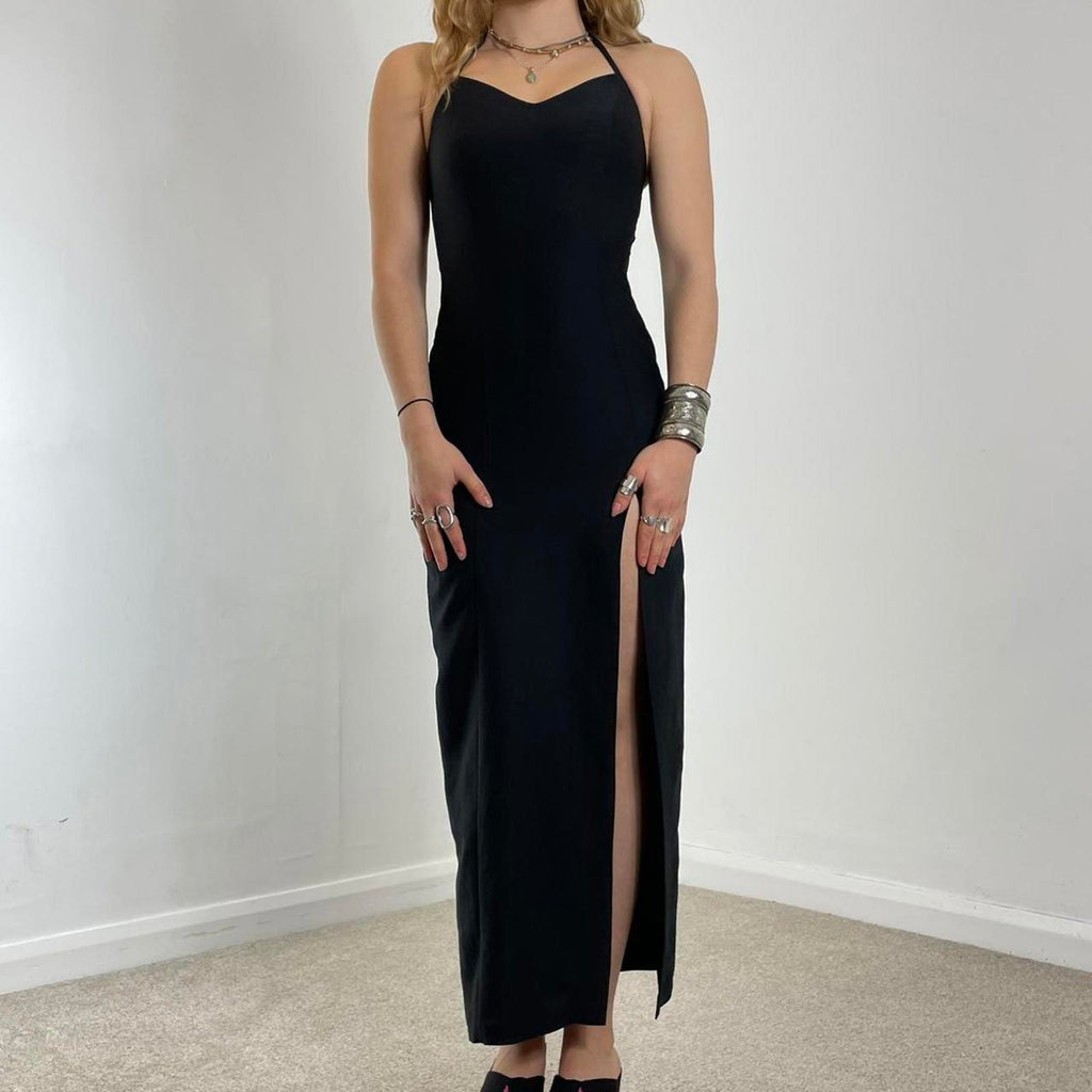 Fitted black evening dress with a split in the leg