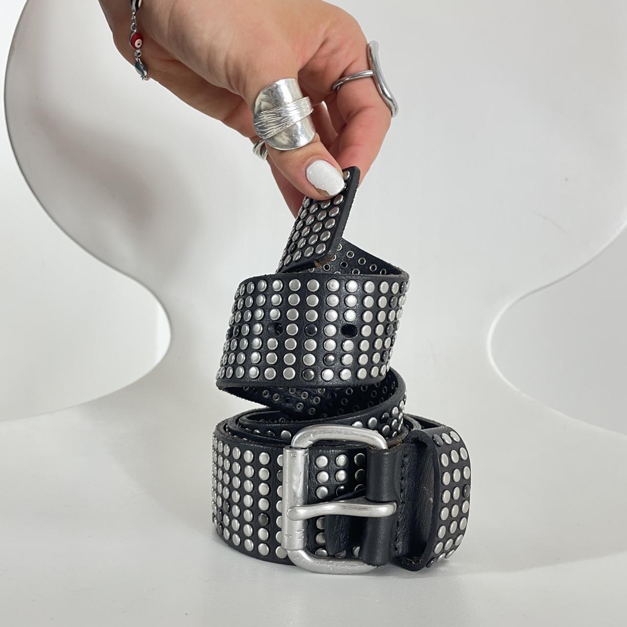 Studded silver belt on black leather