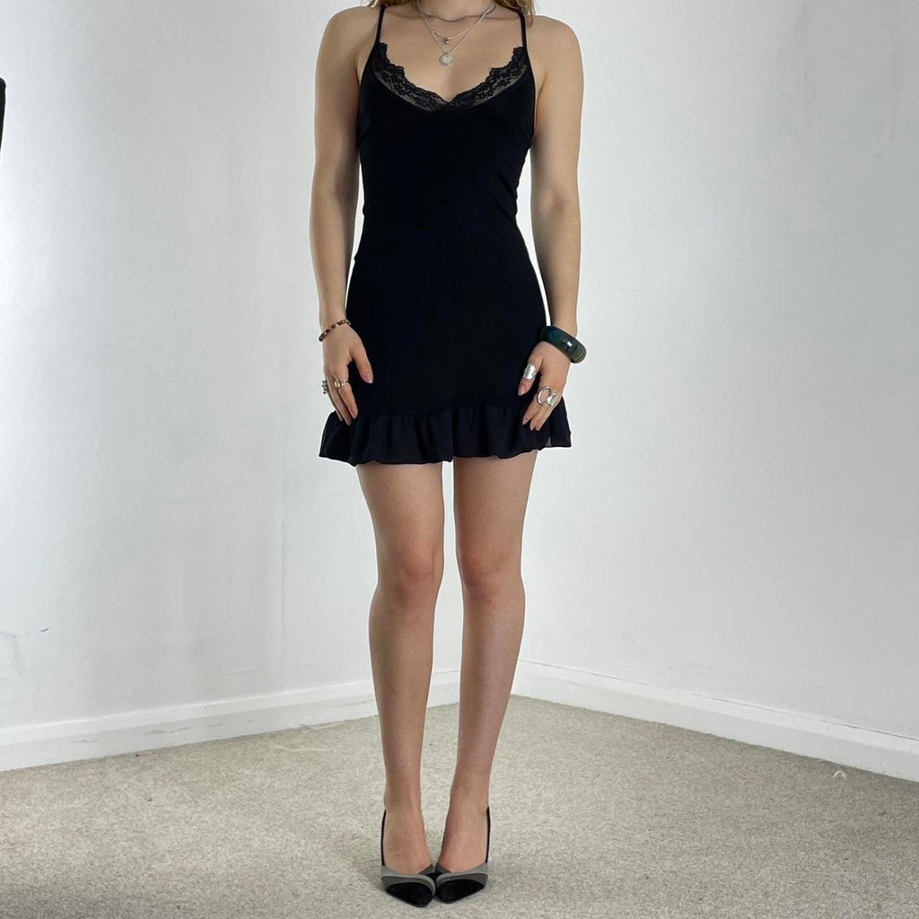 Vintage black elasticaled dress with lace trimming and flared hem