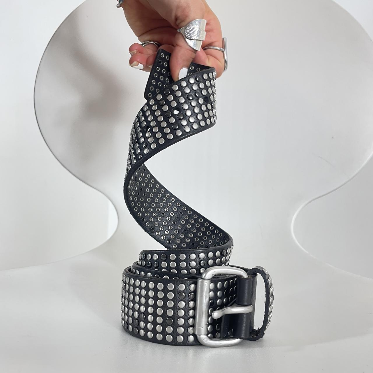 Studded silver belt on black leather