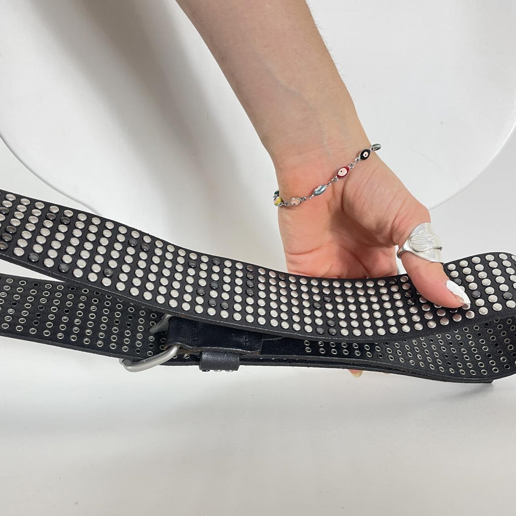 Studded silver belt on black leather
