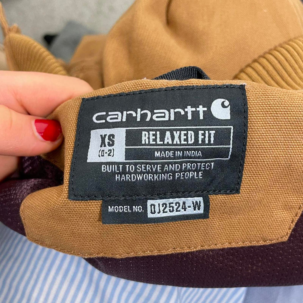 Carhartt fitted mustard canvas jacket with the logo on the side, zips up