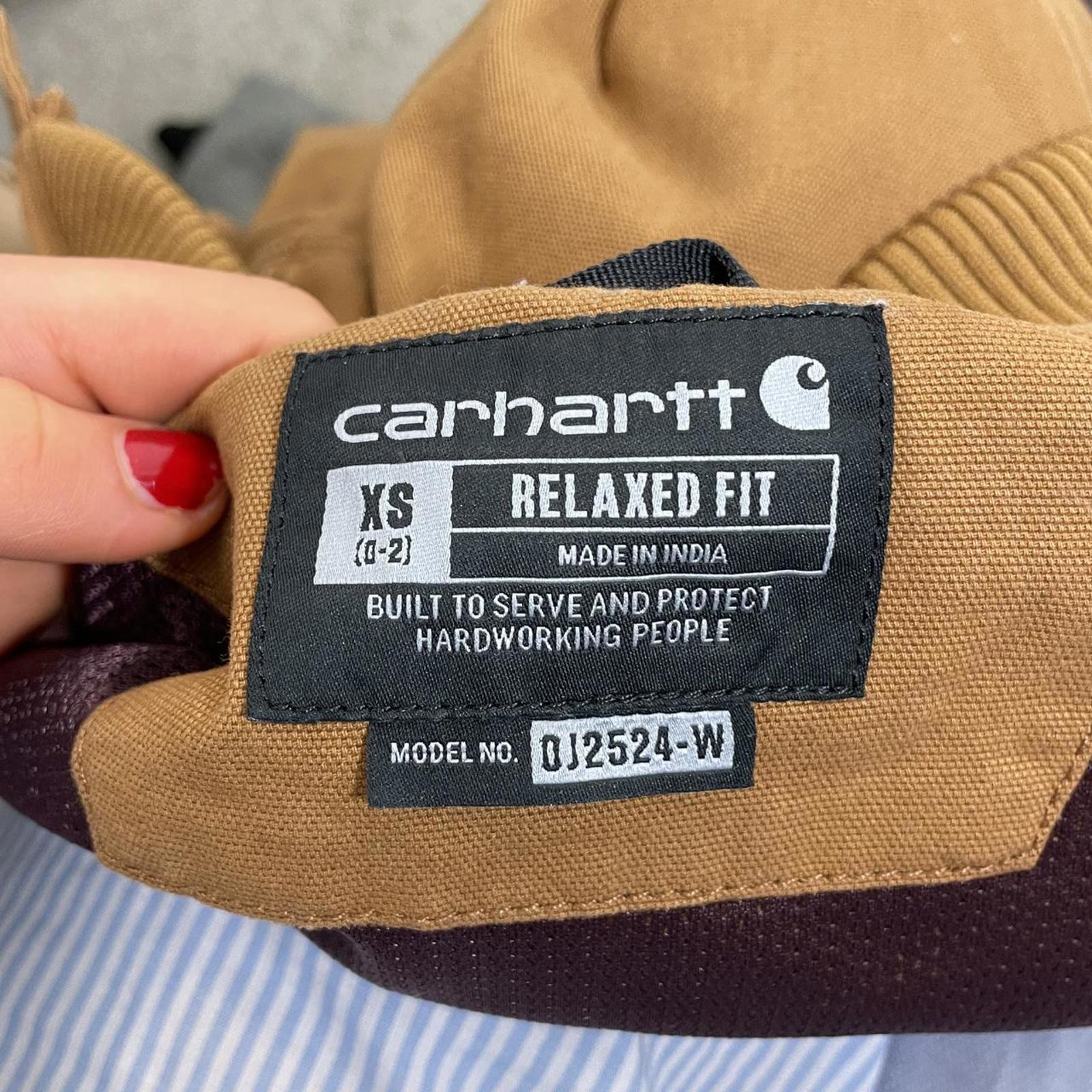 Carhartt fitted mustard canvas jacket with the logo on the side, zips up