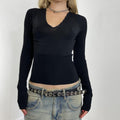 Black fitted long sleeve with a ribbed waist band
