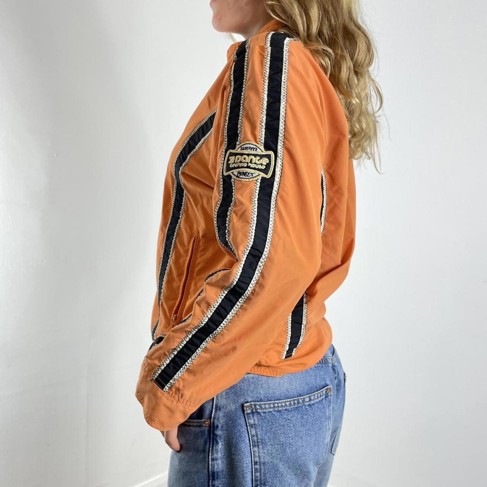 Orange racer windbreaker jacket with graphic detailing