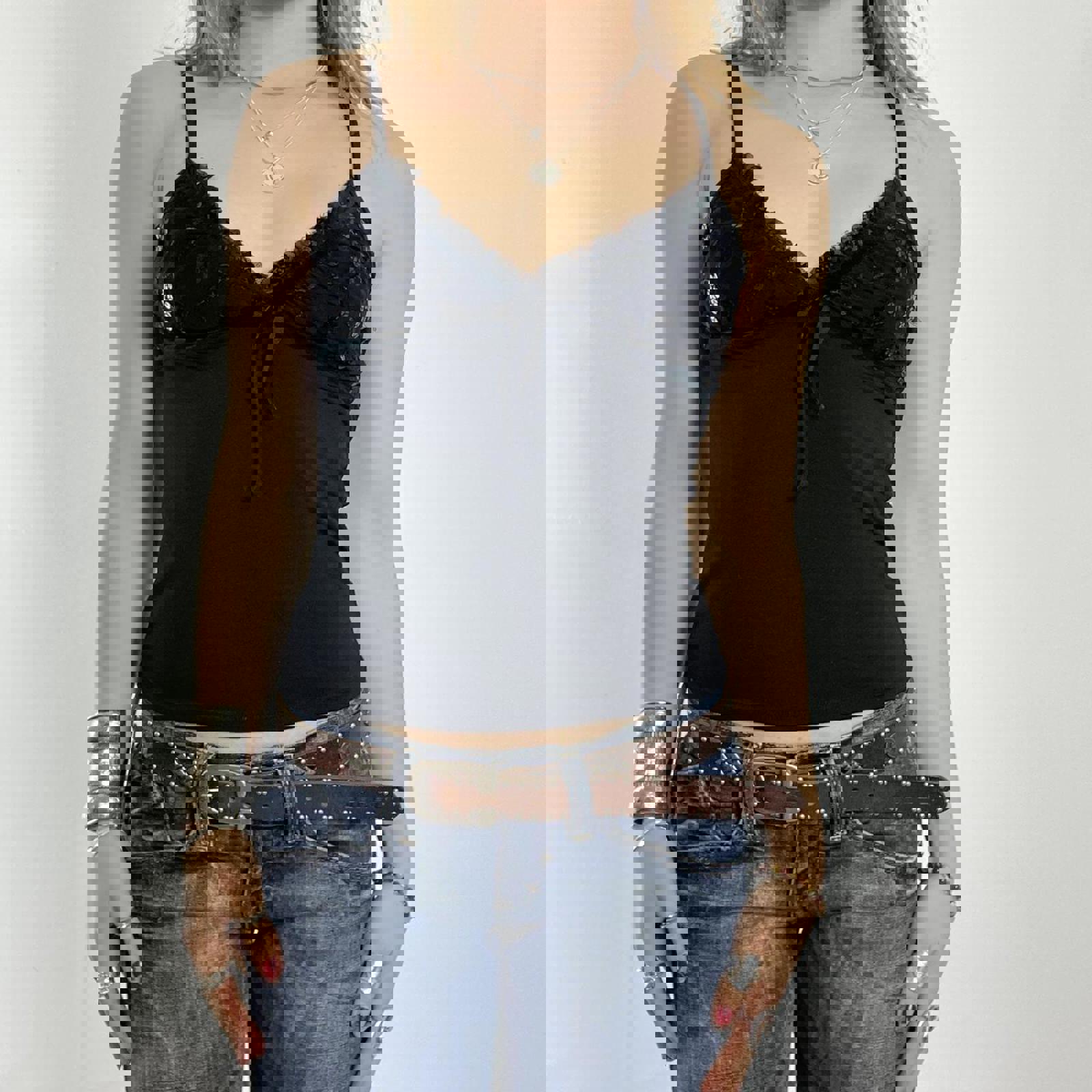 00's black cami with sequined cups and a bow under the bust