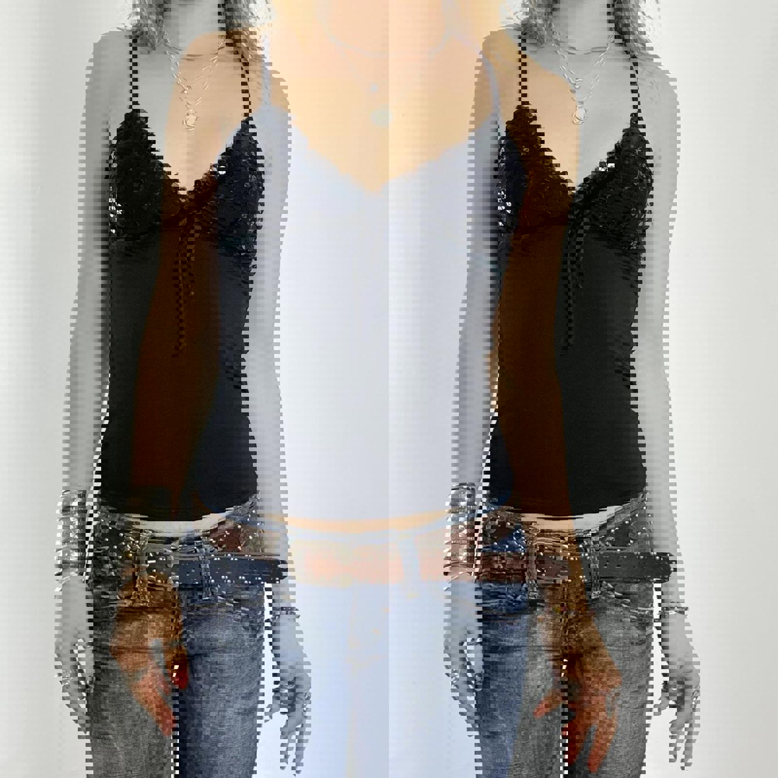 00's black cami with sequined cups and a bow under the bust