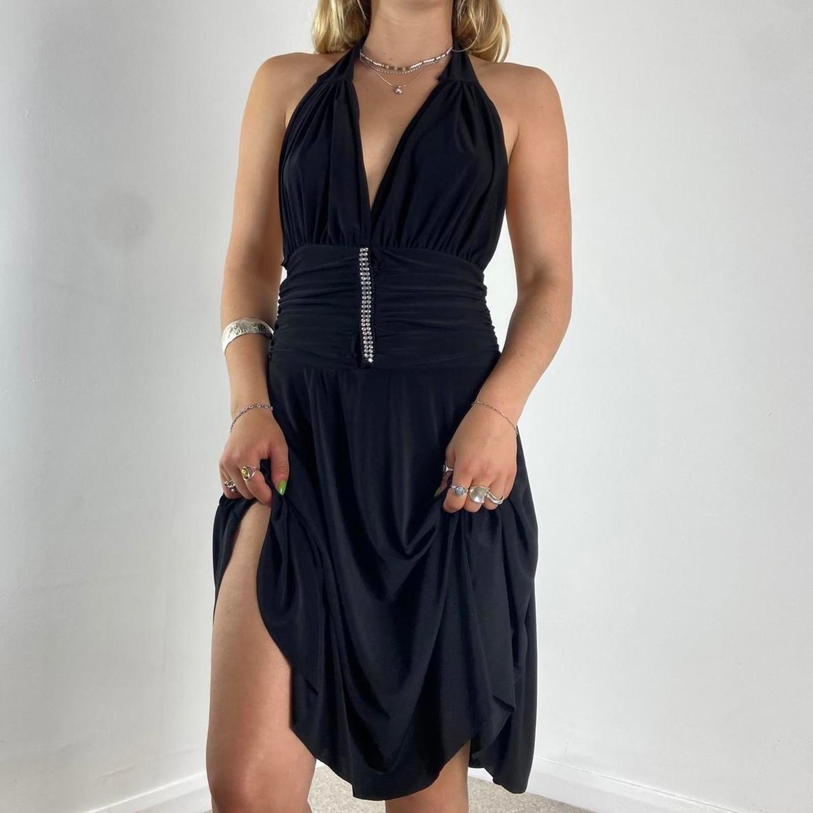 V neck black dance dress with a low cut back and beautiful silver sequins in the middle
