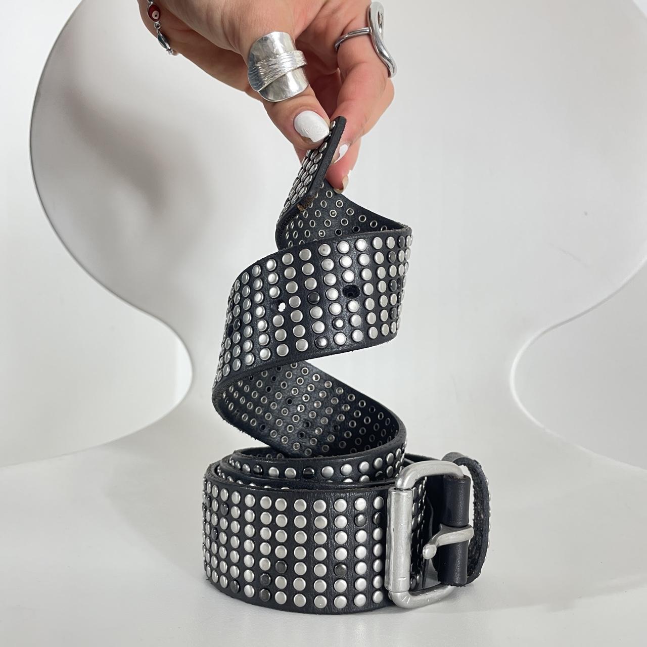 Studded silver belt on black leather