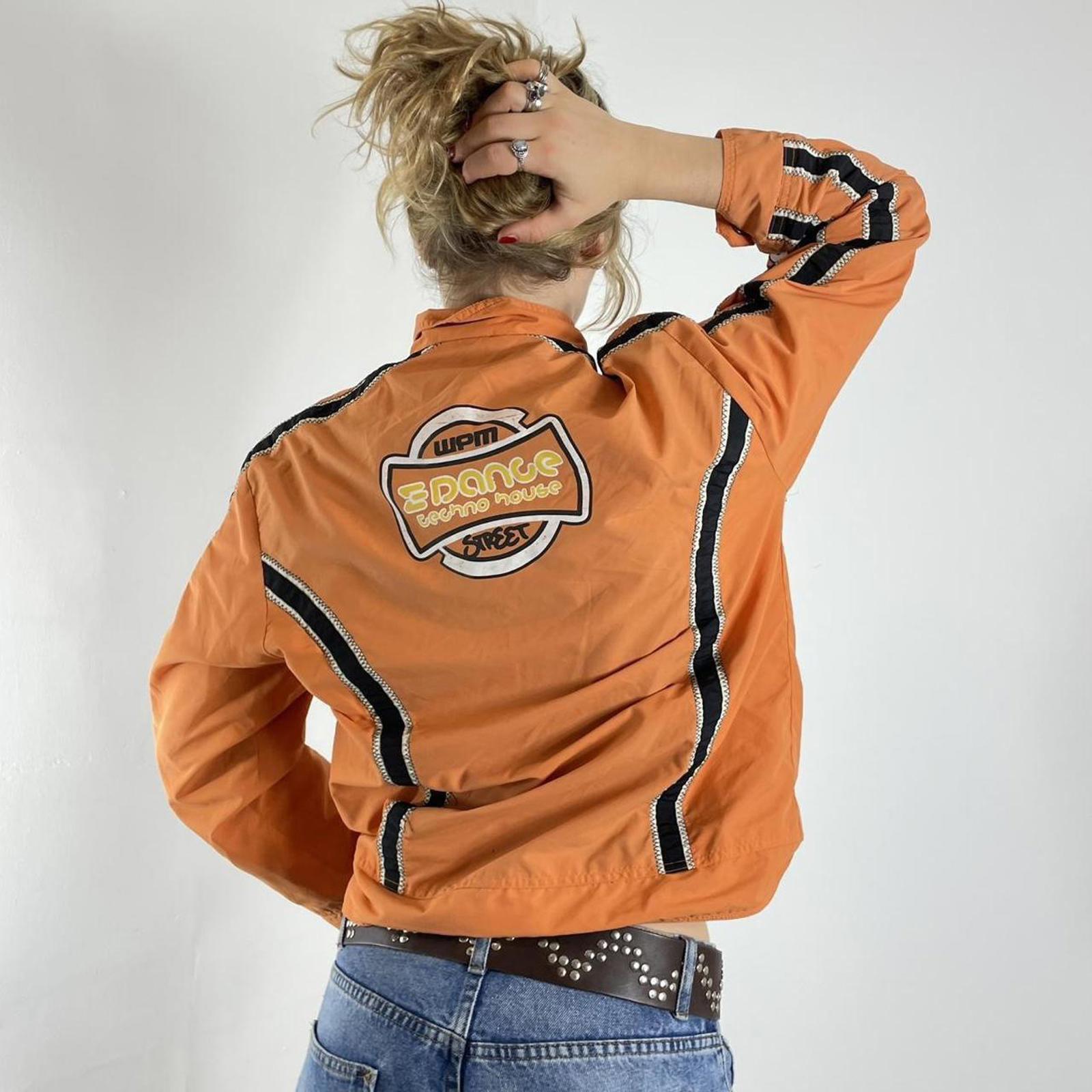Orange racer windbreaker jacket with graphic detailing